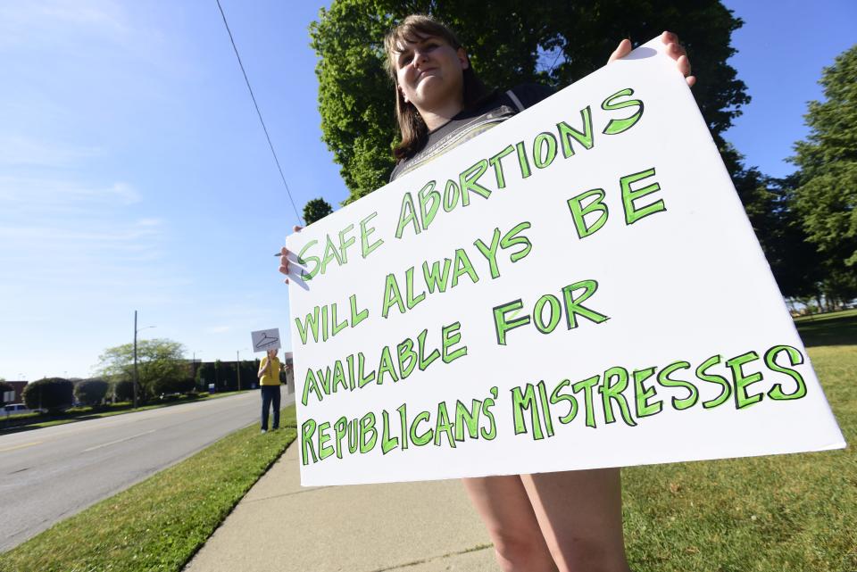 Addie Russel holds a sign protesting abortion rights during a rally for abortion rights at Pine Grove Park in Port Huron on Friday, June 24, 2022. The rally was organized following the long-expected decision from SCOTUS overturning Roe vs. Wade.