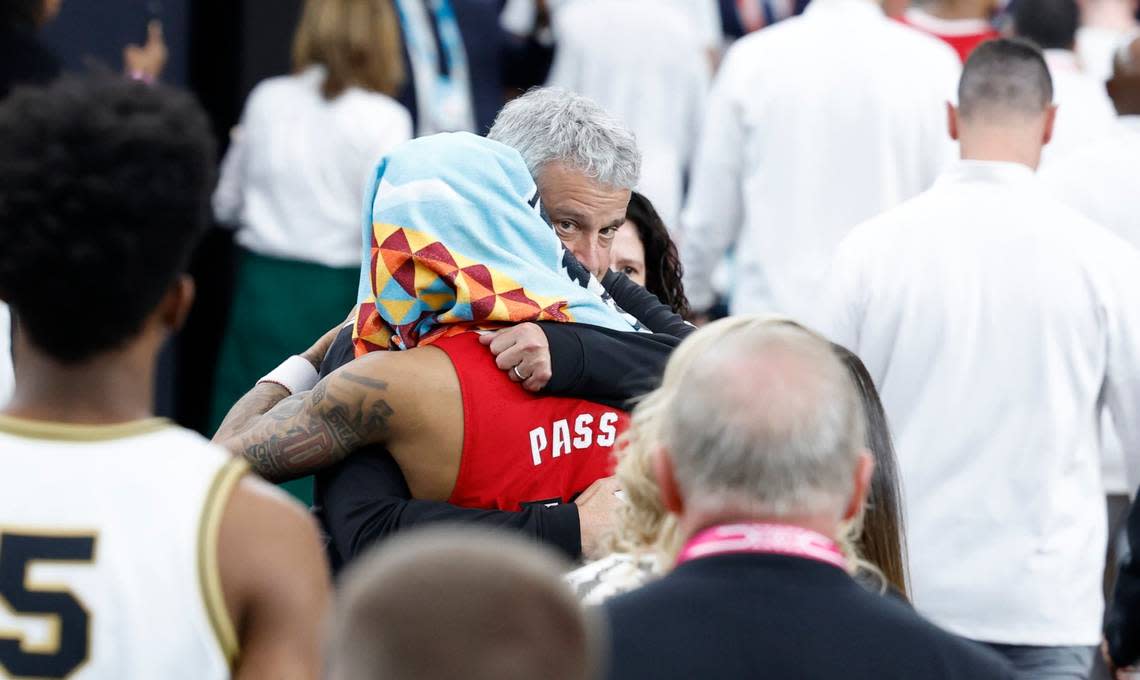 N.C. State athletics director Boo Corrigan hugs Breon Pass (10) after Purdue’s 63-50 victory over N.C. State in the NCAA Tournament national semifinals at State Farm Stadium in Glendale, Ariz., Saturday, April 6, 2024. Ethan Hyman/ehyman@newsobserver.com