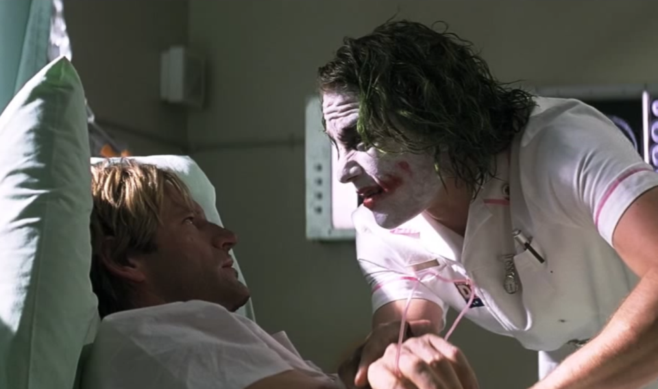 Aaron Eckhart and Heath Ledger in 'The Dark Knight' - Credit: Warner Bros.