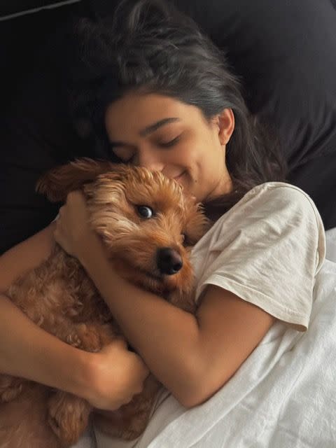 a person sleeping with a dog