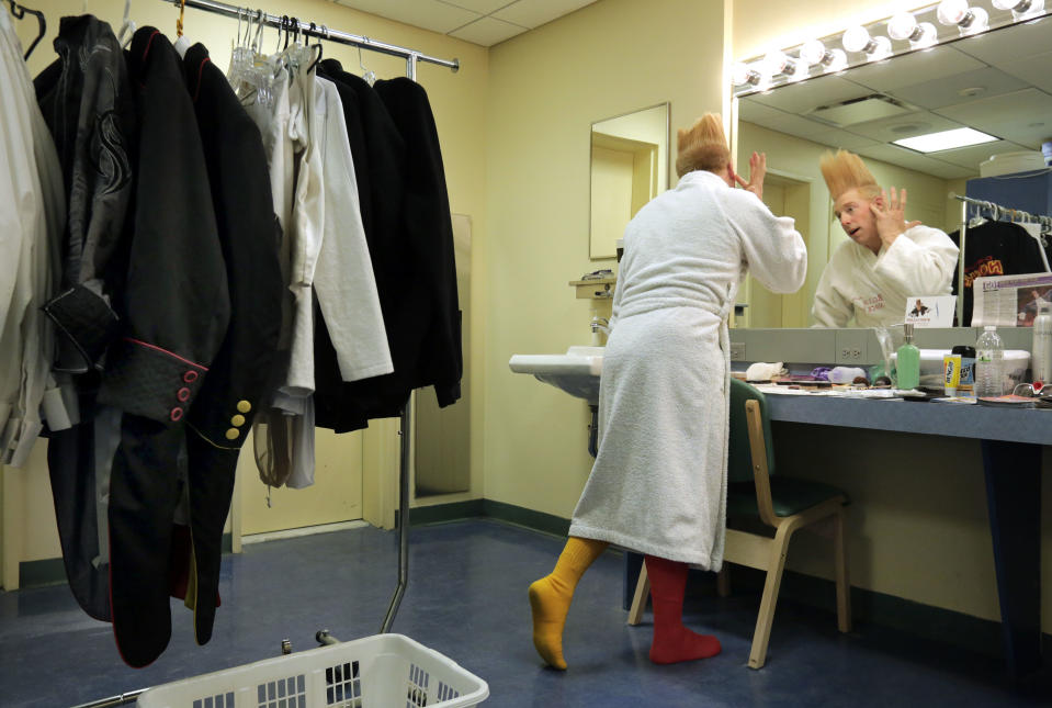 This March 23, 2013 photo shows performer Bello Nock appling make-up in his dressing room as he prepares for his "Bello Mania" show at the New Victory Theater in New York. Nock, a seventh-generation circus performer, is never offstage during the 90-minute performance, which combines slapstick clowning with death-defying aerial stunts. He performs through March 31 at the New Victory before moving on to the Canadian side of Niagara Falls and then a 10-week stint at the Beau Rivage Casino in Biloxi, Miss. (AP Photo/Richard Drew)