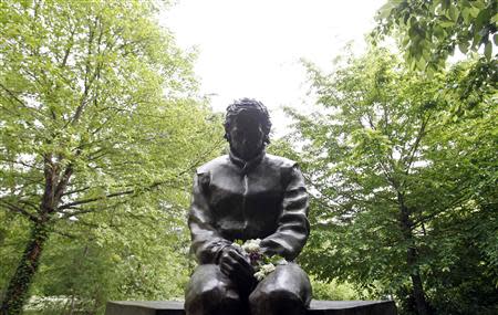 A memorial statue of Brazilian Formula One driver Ayrton Senna is seen in the park inside the race track at Imola April 22, 2014. REUTERS/Alessandro Garofalo