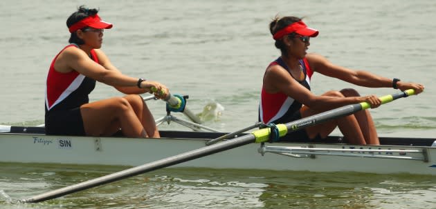 Joanna Chan Lai Cheng and Saiyidah Aisyah of Singapore warm up for the women's pairs on day four of the 2011 Southeast Asian Games at Danau Cipule Regatta Course on November 14, 2011 in Jakarta, Indonesia. (Photo by Cameron Spencer/Getty Images)