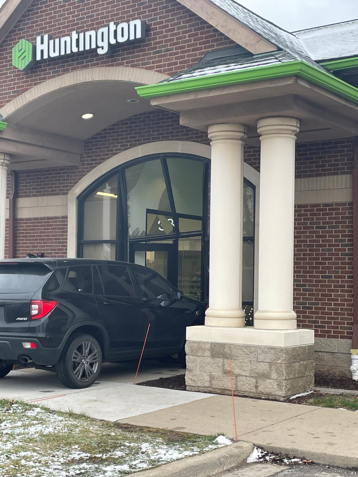 Police say they've arrested a 42-year-old Howell man they allege crashed his SUV intentionally into a Huntington Bank before fleeing on foot.