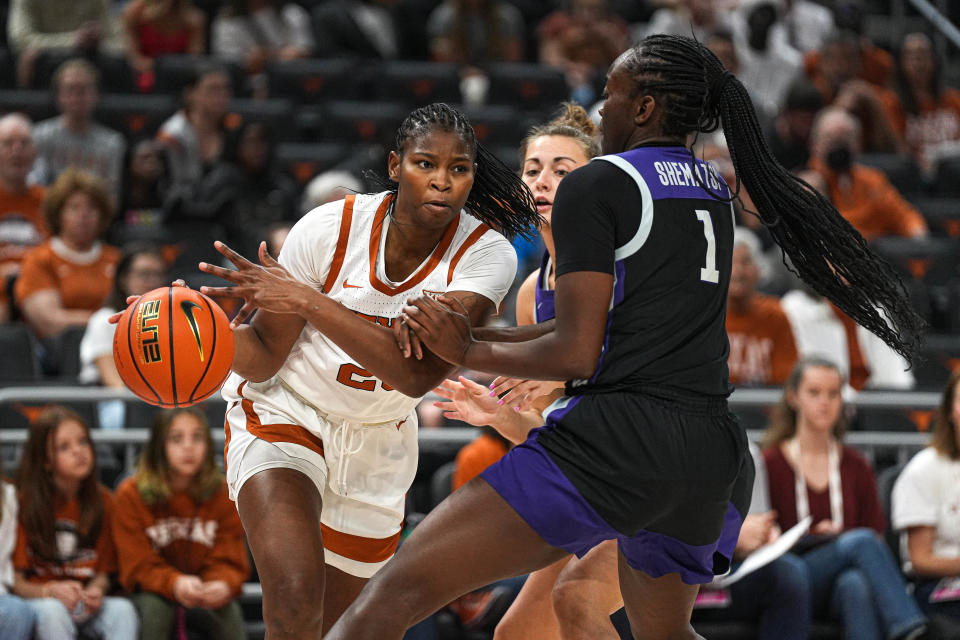 Texas forward Khadija Faye pushes past Kansas State forward Sarah Shematsi during the Longhorns' win last Saturday at Moody Center. Faye had played in 38 career games for Texas Tech when she decided to transfer this summer. Her dream is to play in the WNBA.