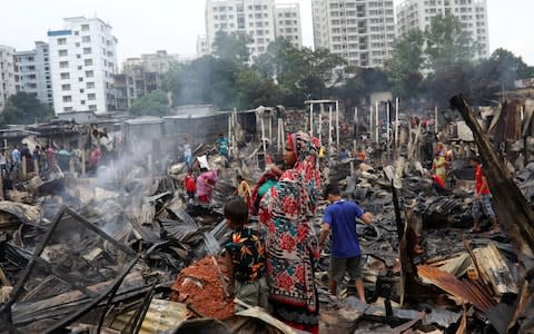 Up to 50,000 people could be rendered homeless by the blaze - Credit: REUTERS/Mohammad Ponir Hossain