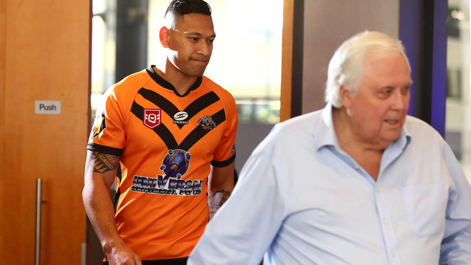 Israel Folau, pictured here arriving at his press conference with Clive Palmer. 