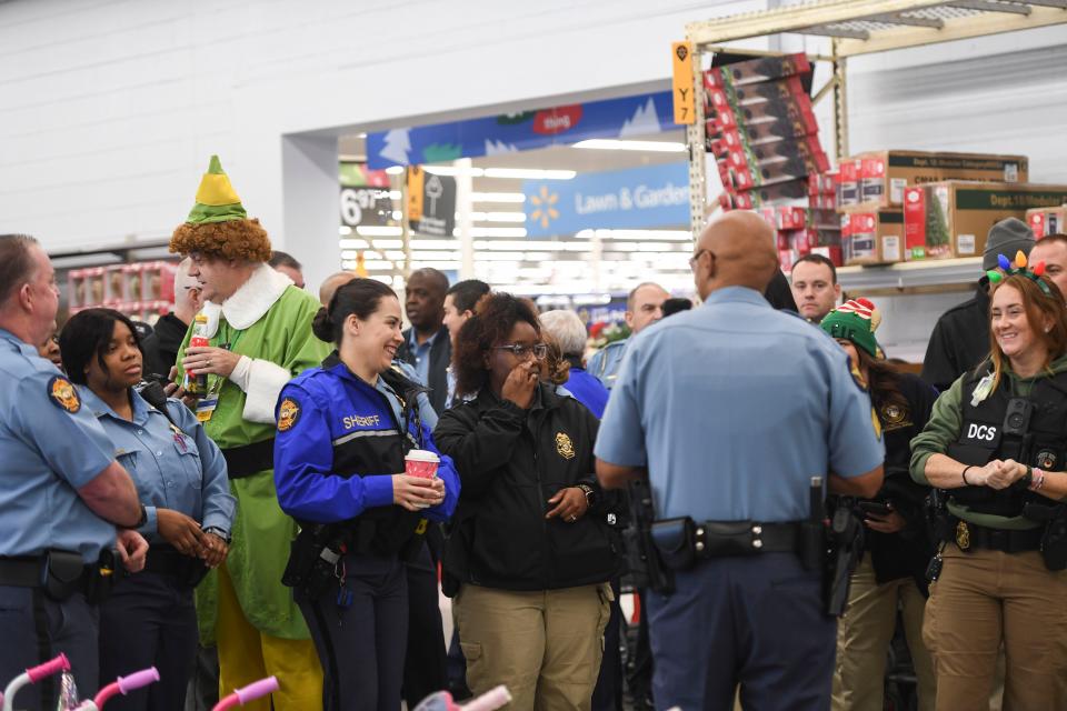 Columbia County police officers wait for the start of the Columbia County Sheriff's Office Day with a Deputy at Walmart on Thursday, Dec. 21, 2023.