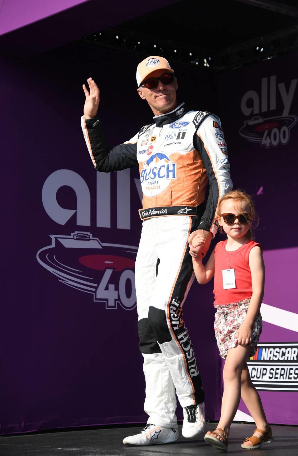 Jun 25, 2023; Nashville, Tennessee, USA; NASCAR Cup Series driver Kevin Harvick (4) crosses the stage during driver introductions before the Ally 400 at Nashville Superspeedway. Christopher Hanewinckel/Christopher Hanewinckel-USA TODAY Sports