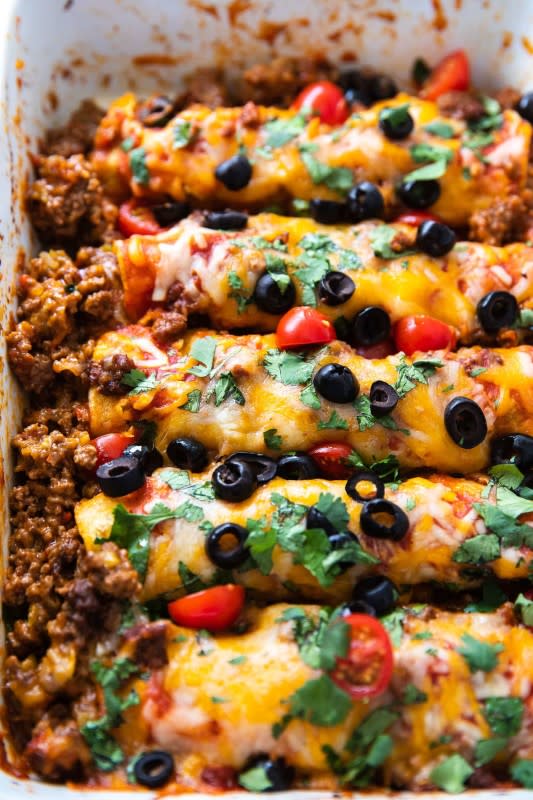 <p>Casserole Crissy</p><p>What’s not to love about ground beef, lots of cheese and loads of delicious flavor? These easy beef enchiladas are totally yummy.</p><p><strong>Get the recipe: <a href="https://casserolecrissy.com/easy-ground-beef-enchiladas/" rel="nofollow noopener" target="_blank" data-ylk="slk:Easy Ground Beef Enchiladas;elm:context_link;itc:0;sec:content-canvas" class="link rapid-noclick-resp">Easy Ground Beef Enchiladas</a></strong></p>