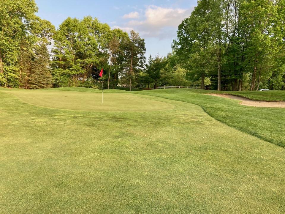 The 7th green slopes from back to front at Huntmore Golf Club in Brighton Township, May 20, 2023.