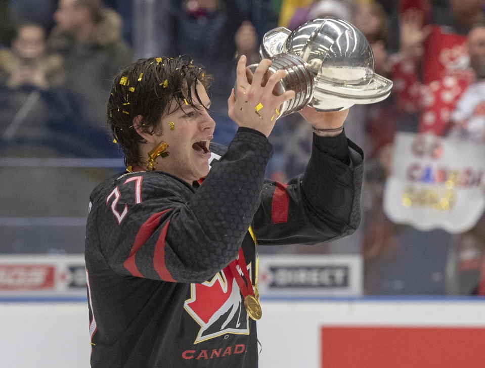 Canada's captain Barrett Hayton holds the trophy as he celebrates after defeating Russia in the gold medal game at the World Junior Hockey Championships, Sunday, Jan. 5, 2020 in Ostrava, the Czech Republic. (Ryan Remiorz/The Canadian Press via AP)