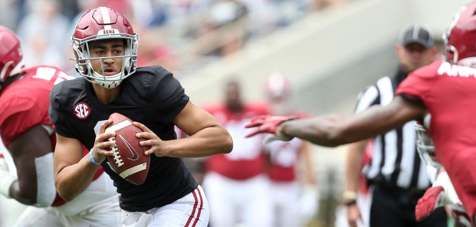 White quarterback Bryce Young (9) rolls out to avoid the rush during the University of Alabama A-Day game Saturday, April 17, 2021, in Bryant-Denny Stadium. [Staff Photo/Gary Cosby Jr.]