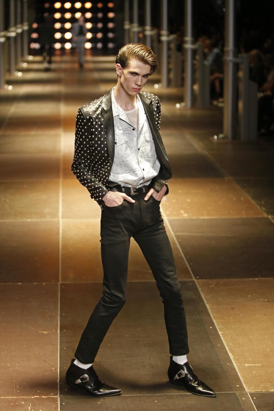 A model presents a creation as part of Yves Saint Laurent's men's fashion Spring-Summer 2014 collection, presented Sunday, June 30, 2013 in Paris. (AP Photo/Francois Mori)