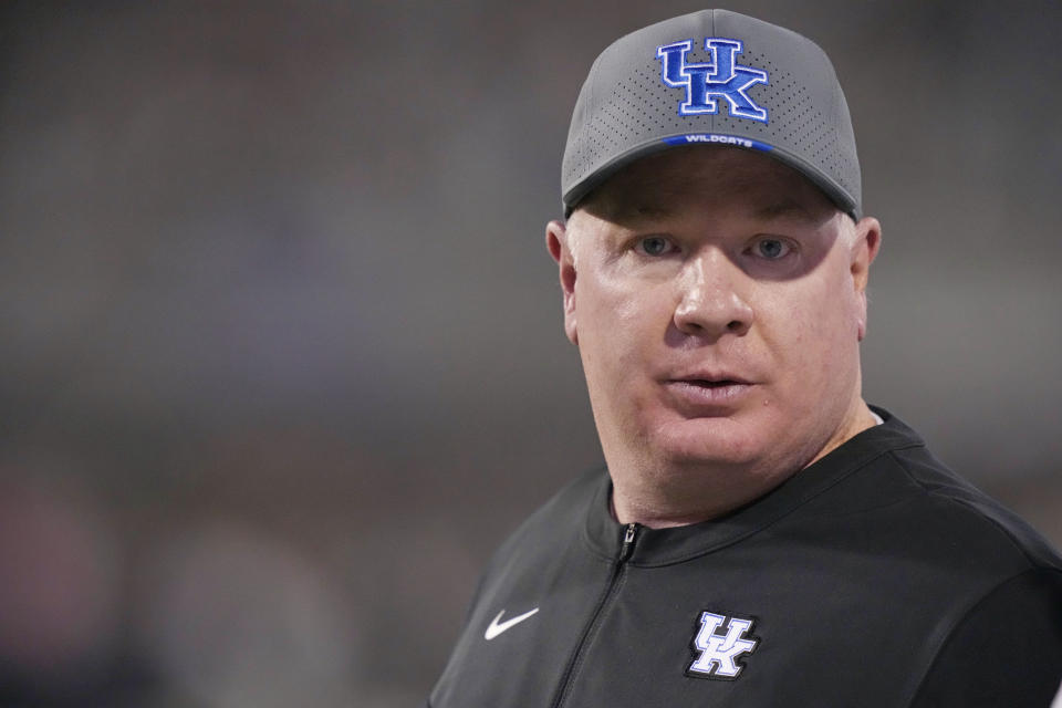 Kentucky head coach Mark Stoops stares at an official during the first half of the team's NCAA college football game against Mississippi in Starkville, Miss., Saturday, Nov. 4, 2023. (AP Photo/Rogelio V. Solis)