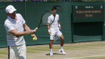 Novak Djokovic of Serbia and coach Boris Becker during a practice session at the Wimbledon Tennis Championships in London, July 9, 2015. REUTERS/Suzanne Plunkett