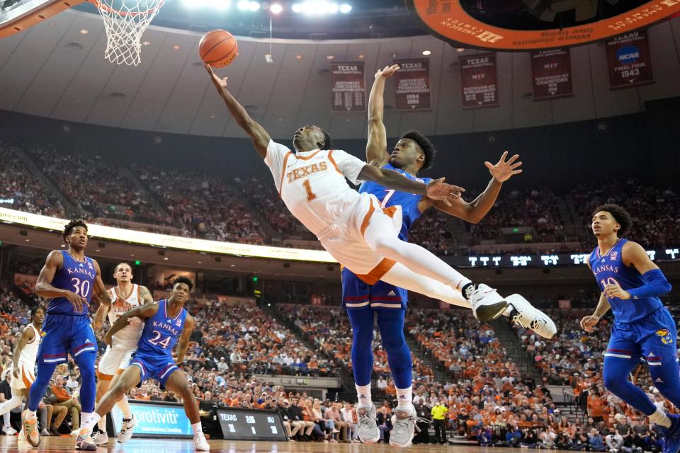 Texas guard Andrew Jones drives to the basket past Kansas' Joseph Yesufu during the Longhorns' 79-76 win at the Erwin Center on Feb. 7. Jones needs 11 points to move into ninth place on UT's career scoring list.