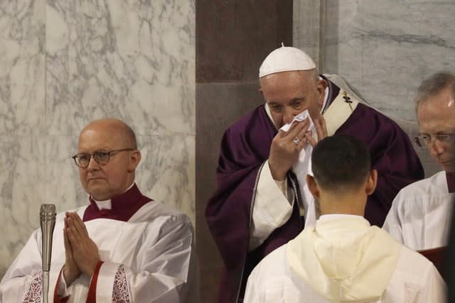 Pope Francis wipes his nose during the Ash Wednesday Mass