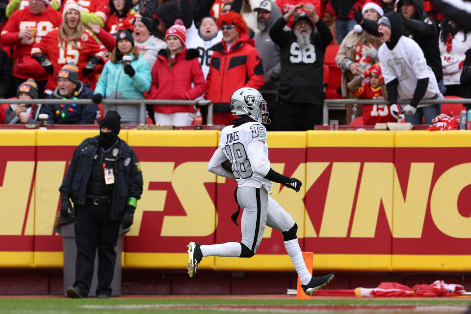 KANSAS CITY, MISSOURI – DECEMBER 25: Jack Jones #18 of the Las Vegas Raiders returns an interception for a touchdown during the second quarter against the Kansas City Chiefs at GEHA Field at Arrowhead Stadium on December 25, 2023 in Kansas City, Missouri.  (Photo by Jamie Squire/Getty Images)