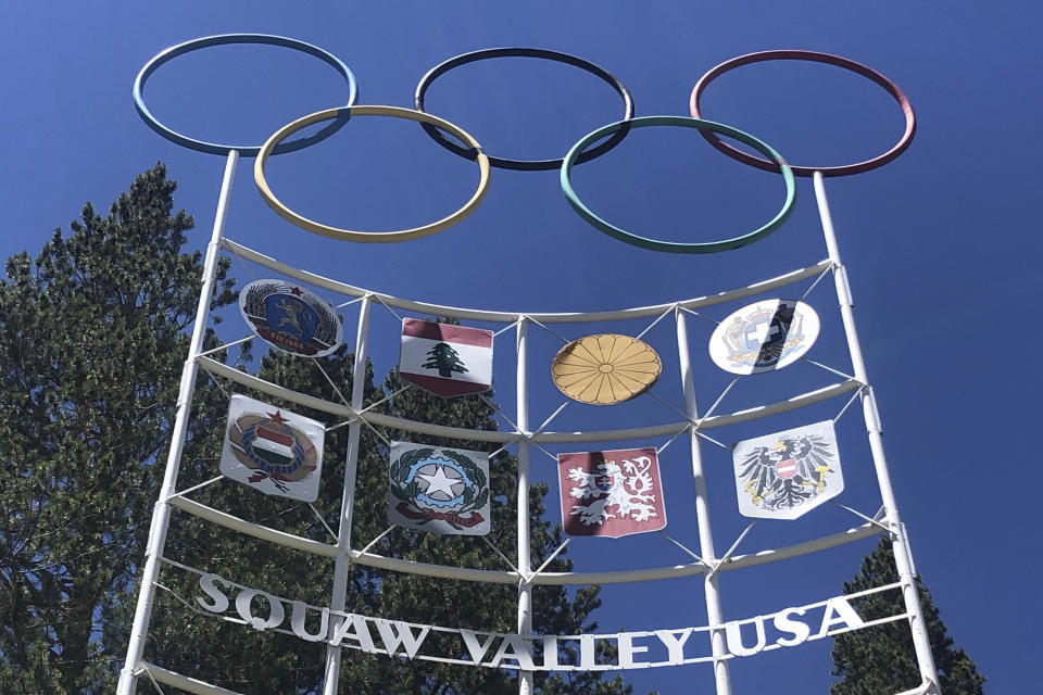 FILE In this July 8, 2020 file photo, the Olympic rings stand atop a sign at the entrance to the Squaw Valley Ski Resort in Olympic Valley, Calif. Officials announced Tuesday, Aug. 25 California’s popular Squaw Valley Ski Resort will change its name because the word “squaw” is a derogatory term for Native American women. The site was the scene of the 1960 Winter Olympics. (AP Photo/Haven Daley,File)