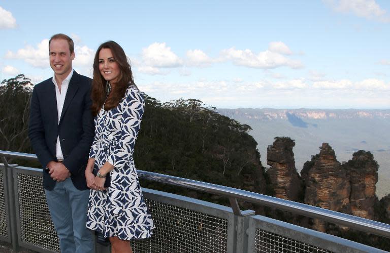 Britain's Prince William (L) and his wife Catherine, the Duchess of Cambridge, pose in front of the Three Sisters rock formation in the Blue Mountains, west of Sydney, on April 17, 2014