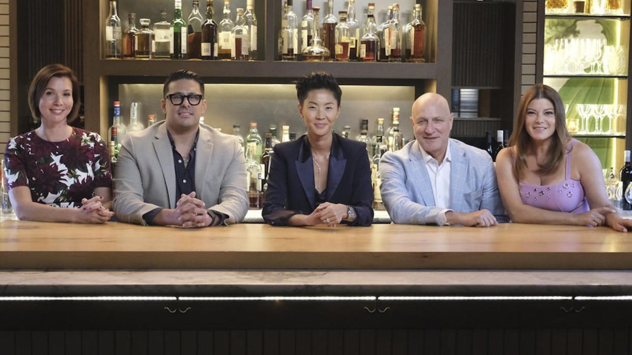  Kristen, Tom and Gayle sitting at judge's table in Top Chef Wisconsin. 