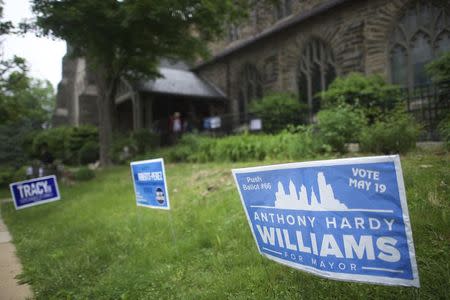 Campaign posters for Tony Williams, a Philadelphia mayoral candidate, are seen outside of the Summit Presbyterian Church in Philadelphia, Pennsylvania on May 19, 2015. REUTERS/Mark Makela