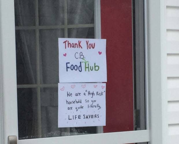 This sign has been posted in a food hub member's door throughout the pandemic. 