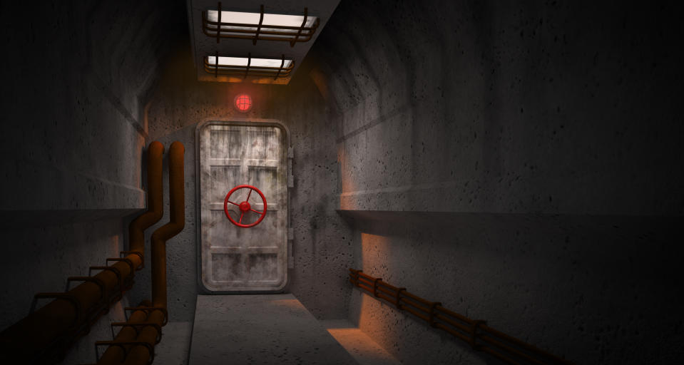 A dimly lit, industrial hallway leads to a heavy metal door with a red circular handle. Pipes run along the walls and ceiling