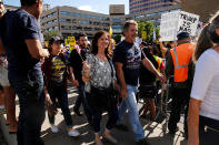 <p>Supporters of Republican presidential candidate Donald Trump smile as they pass by anti-Trump protesters to wait in line before the start of his rally in Albuquerque, N.M., Tuesday, May 24, 2016. (Reuters/Jonathan Ernst) </p>