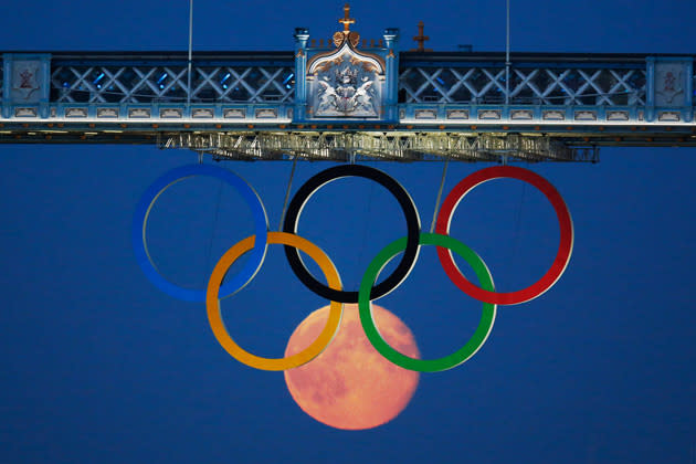 #3 Moon as Olympic ring<br>The full moon rises through the Olympic Rings hanging beneath Tower Bridge during the London 2012 Olympic Games.