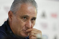 Brazil's head coach listens to a question during a press conference on the eve of the group G of World Cup soccer match between Brazil and Cameroon in Doha, Qatar, Thursday, Dec. 1, 2022. (AP Photo/Andre Penner)