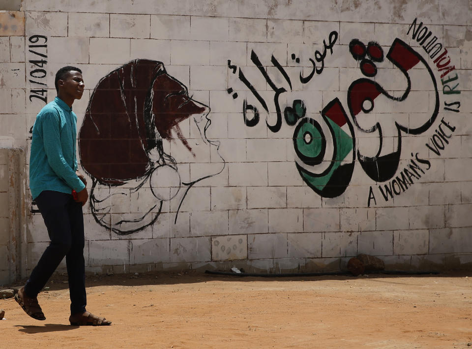 Graffiti by Sudanese opposition is painted on a wall near the defense ministry, in Khartoum, Sudan, Wednesday, June 19, 2019. Sudan's military council is urging protest leaders to resume negotiations on the transition of power, but says talks "should not be preconditioned." (AP Photo/Hussein Malla)