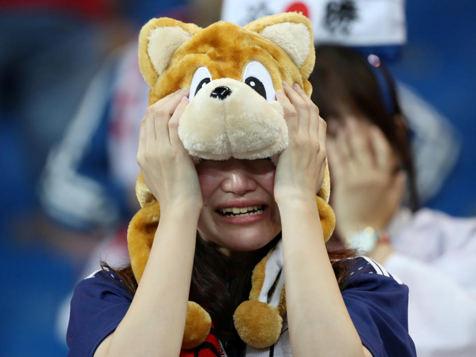 <p>Japan fan looks dejected after the match REUTERS/Marko Djurica </p>