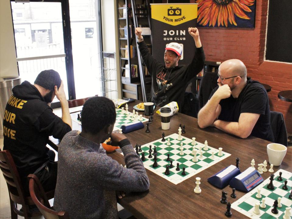 Club organizer Dustin Hopkins falls to his opponent while club members watch. He said that banter is greatly appreciated at the club, something that he said to have introduced after the many years playing with mentor and Quinsigamond Community College professor Jerry Williams.