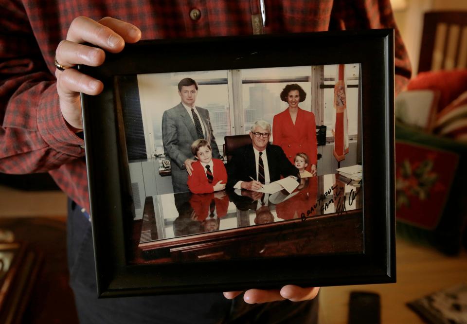 Jacksonville City Council member Matthew Carlucci holds a framed photograph of himself, his wife Karen and their children Matt and Joe with Mayor Ed Austin from December, 1991 as Austin signed an ordinance championed by Carlucci to create Jacksonville's Ethics Commission, one of Carlucci's first accomplishments as a City Council Member. Wednesday, December 20, 2023. The Carlucci family has been a fixture in Jacksonville politics starting with Joe Carlucci, who first held political office in 1968 in Jacksonville's City Council then served won a Florida Senate seat in 1978 where he served until his death in 1986. His son, Matthew "Matt" Carlucci became a City Council member in 1987 and continues in that role. Now the third generation of the family, Joe Carlucci, serves on Jacksonville's City Council alongside his father Matt, after recently being elected to represent Jacksonville's District 5. [Bob Self/Florida Times-Union]