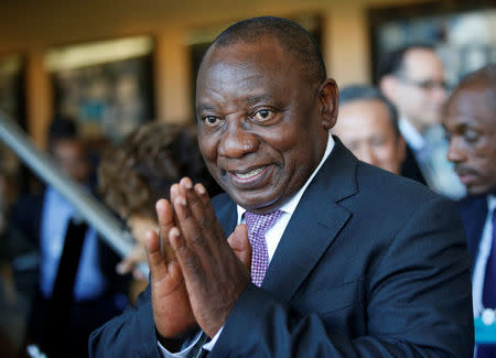 FILE PHOTO: South African Deputy President Cyril Ramaphosa greets security personal at the World Economic Forum on Africa 2017 meeting in Durban, South Africa, May 5, 2017. REUTERS/Rogan Ward/File Photo