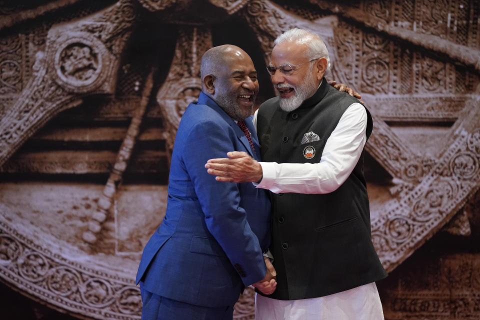 Indian Prime Minister Narendra Modi, right, shares a light moment with African Union Chairman and President of the Union of the Comoros Azali Assoumani upon his arrival at Bharat Mandapam convention centre for the G20 Summit in New Delhi, India, Saturday, Sept. 9, 2023. (AP Photo/Evan Vucci, Pool)