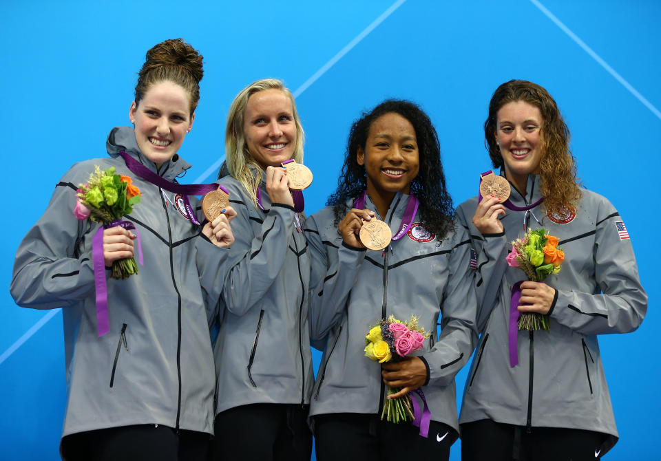 (L-R) <a href="http://sports.yahoo.com/olympics/swimming/missy-franklin-1132902/" data-ylk="slk:Missy Franklin;elm:context_link;itc:0;sec:content-canvas" class="link ">Missy Franklin</a>, <a href="http://sports.yahoo.com/olympics/swimming/jessica-hardy-1134700/" data-ylk="slk:Jessica Hardy;elm:context_link;itc:0;sec:content-canvas" class="link ">Jessica Hardy</a>, <a href="http://sports.yahoo.com/olympics/swimming/lia-neal-1133103/" data-ylk="slk:Lia Neal;elm:context_link;itc:0;sec:content-canvas" class="link ">Lia Neal</a> and <a href="http://sports.yahoo.com/olympics/swimming/allison-schmitt-1133648/" data-ylk="slk:Allison Schmitt;elm:context_link;itc:0;sec:content-canvas" class="link ">Allison Schmitt</a> of the United States celebrate with their bronze medal during the the Medal Cermony for the Women's 4x100m Freestyle Relay on Day One of the London 2012 Olympic Games at the Aquatics Centre on July 28, 2012 in London, England. (Photo by Al Bello/Getty Images)