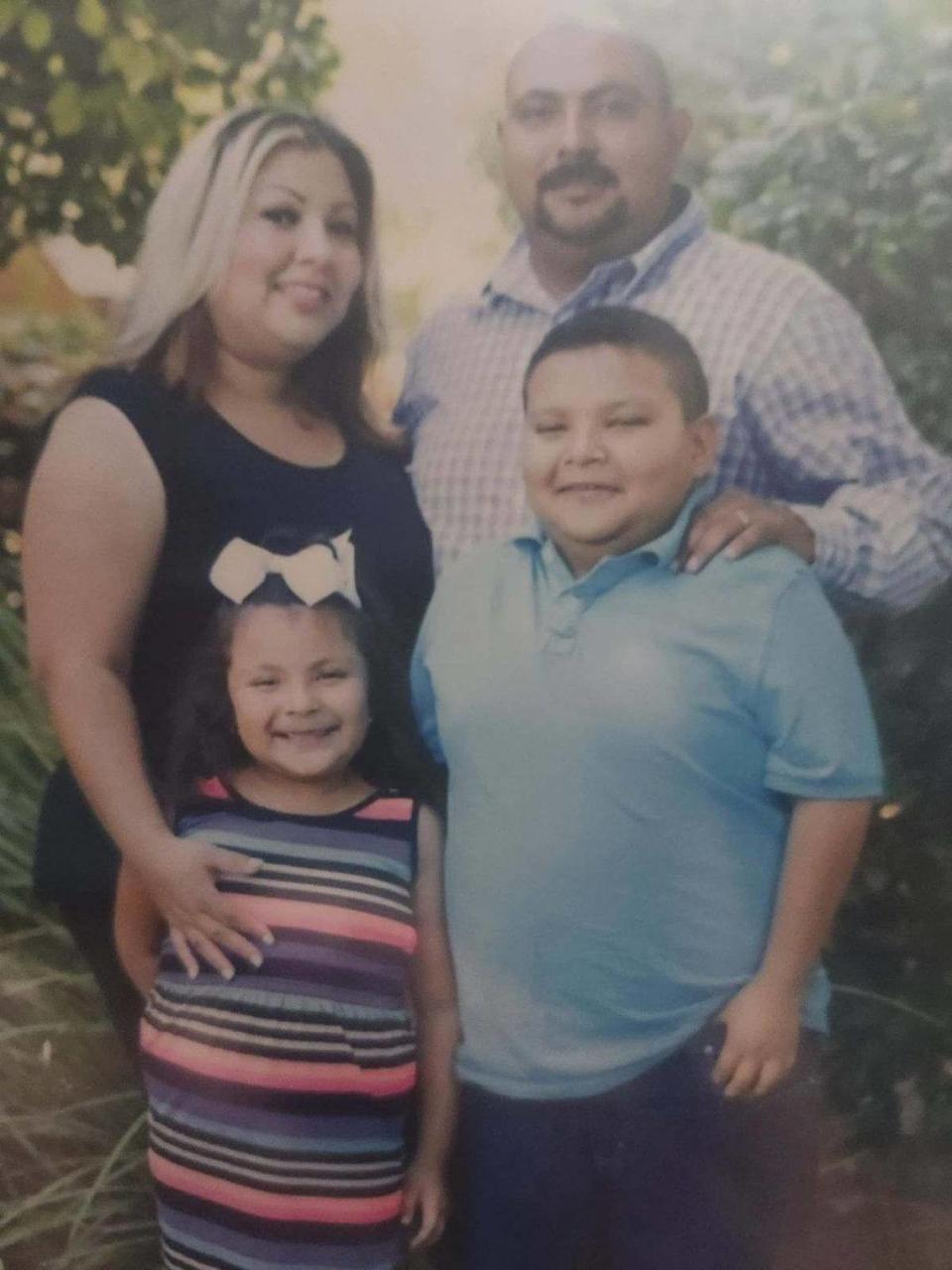 Jose Valladolid Ramirez poses in a family portrait with his wife, Mayra Miranda, and their children, Amayrani and Giovanny Valladolid.