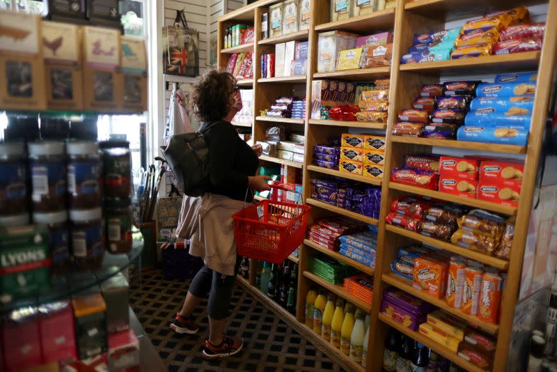 FILE PHOTO: Paula Jarvis, 61, buys biscuits at the King's Head pub as Los Angeles County moves into the least restrictive yellow coronavirus disease (COVID-19) disease reopening tier, in Santa Monica