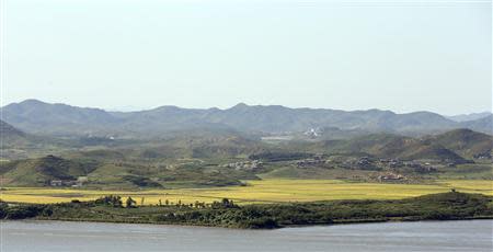 A North Korean village is seen across the Imjin River in this picture taken from an observation post in the south of the demilitarized zone in Paju, north of Seoul September 16, 2013. REUTERS/Han Jae-ho/News1