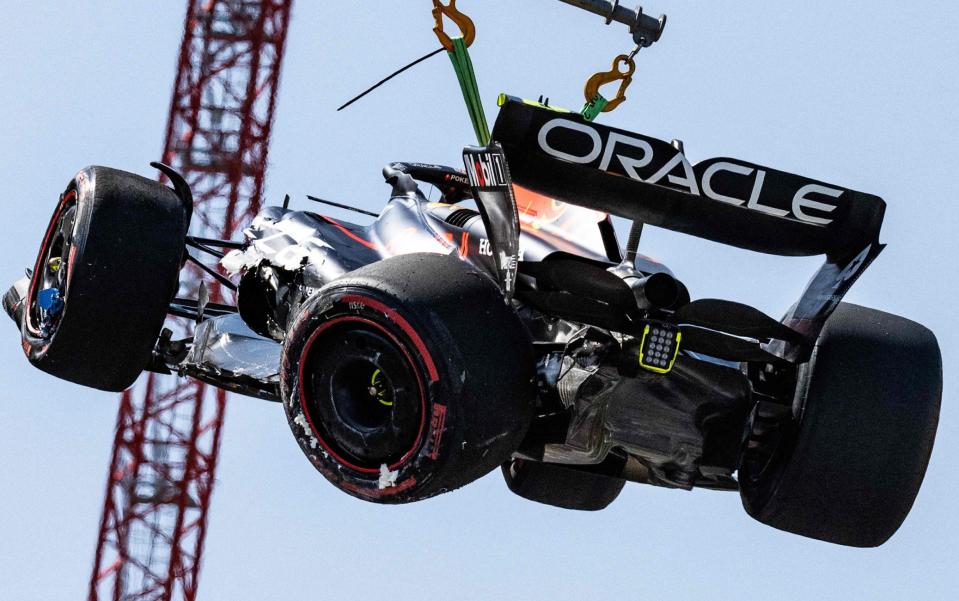 Red Bull Racing's Mexican driver Sergio Perez is removed from the track after he crashed during the qualifying session of the Formula One Monaco Grand Prix at the Monaco street circuit in Monaco, on May 27, 2023. - AFP/Jeff Pachoud