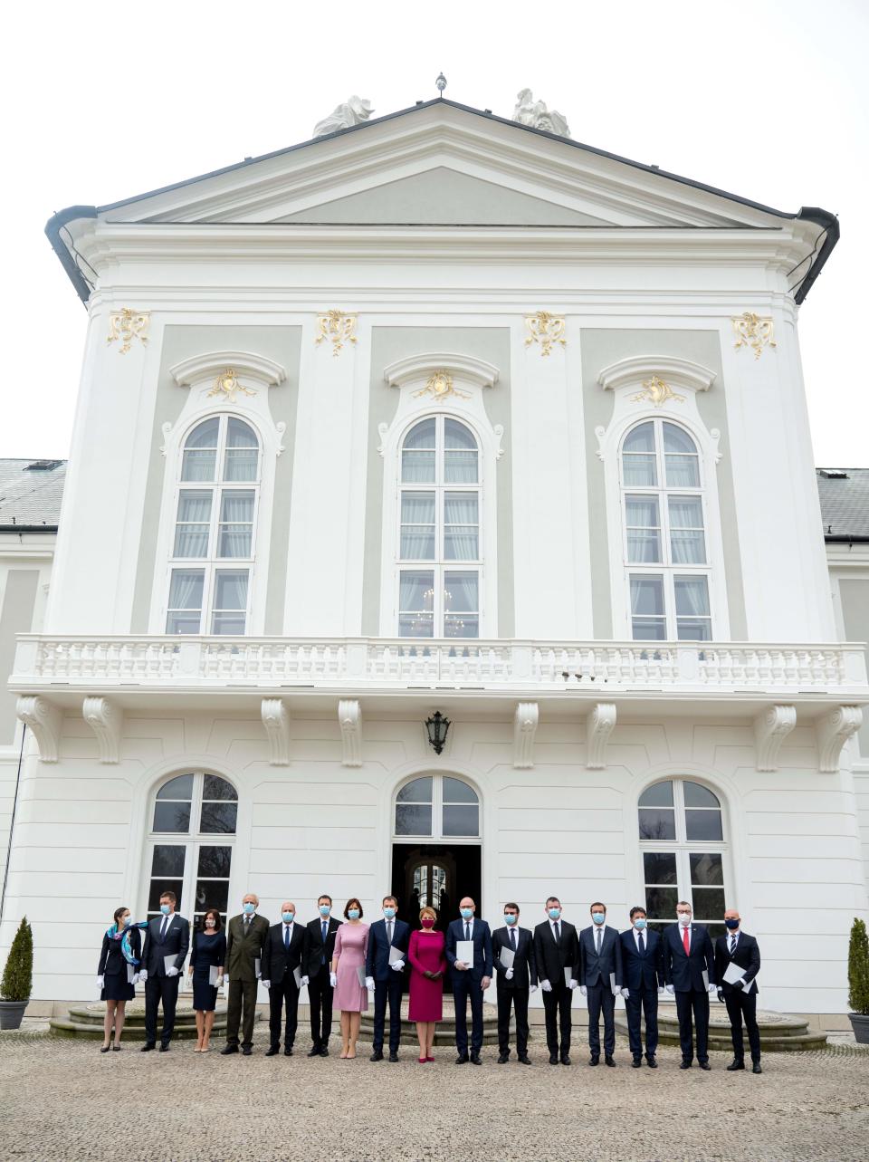 Newly appointed Slovak Prime Minister Igor Matovic (C-L), leader of the OLaNO anti-graft party and President Zuzana Caputova (C-R) pose with Ministers of the new four-party coalition government after a swearing in ceremony on March 21, 2020 outside the Presidential palace in Bratislava. - The ceremony was held without members of the press and all appointed government members wore gloves and face mask to prevent the spread of novel coronavirus. (Photo by JOE KLAMAR / AFP) (Photo by JOE KLAMAR/AFP via Getty Images)