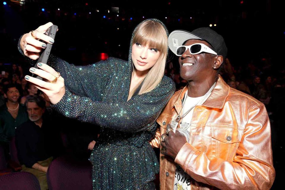 Kevin Mazur/Getty  Flavor Flav poses with Taylor Swift at the iHeartRadio Music Awards