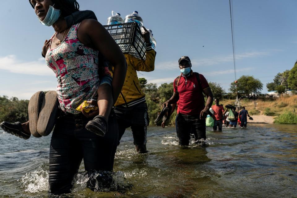 Asylum-seeking migrants reach the Rio Grande river, not far from The International Bridge. (REUTERS)