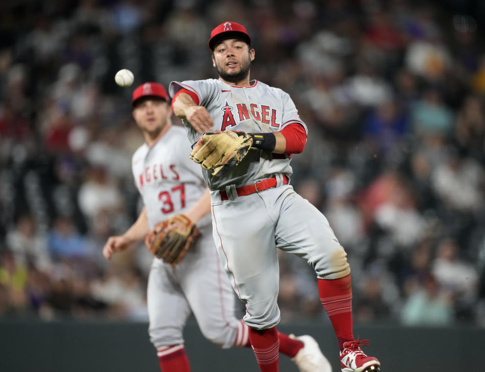 Los Angeles Angels shortstop David Fletcher throws to first base for the out on Colorado Rockies' Jorge Alfaro, ending the eighth inning of a baseball game Saturday, June 24, 2023, in Denver. (AP Photo/David Zalubowski)