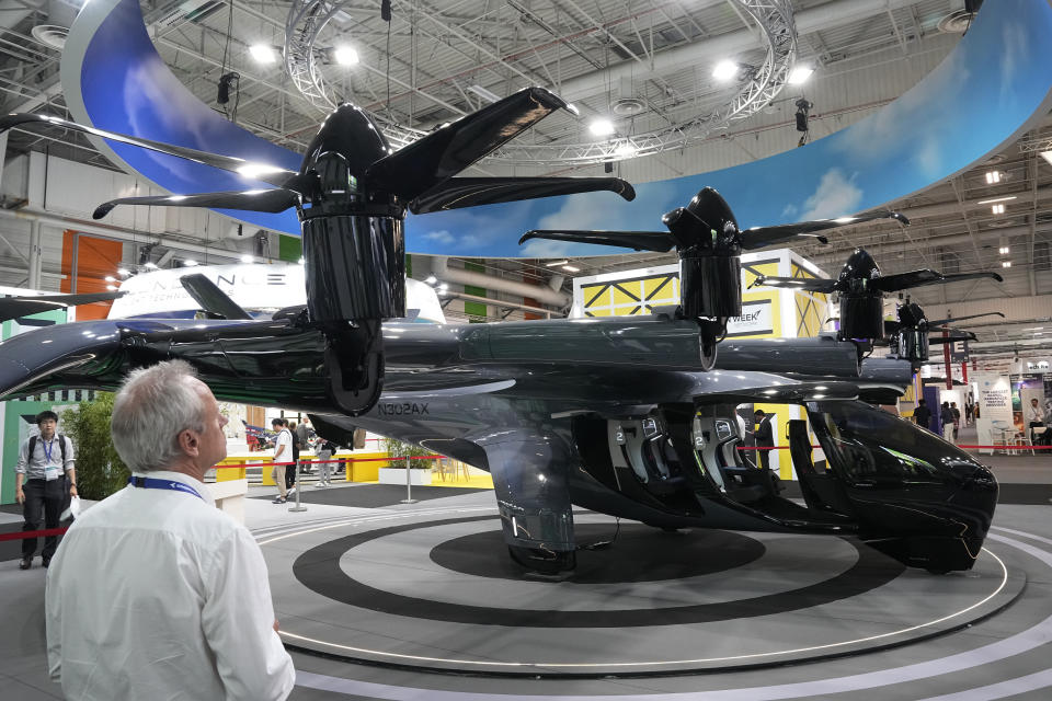 The Archer midnight flying taxi is exhibited at the Paris Air Show, Wednesday, June 21, 2023 in Le Bourget, north of Paris. Aviation industry CEOs and top government officials from around the world descended on the Paris Air Show for a week of deal-making and demonstrations of the world's latest air and space technology. (AP Photo/Michel Euler)