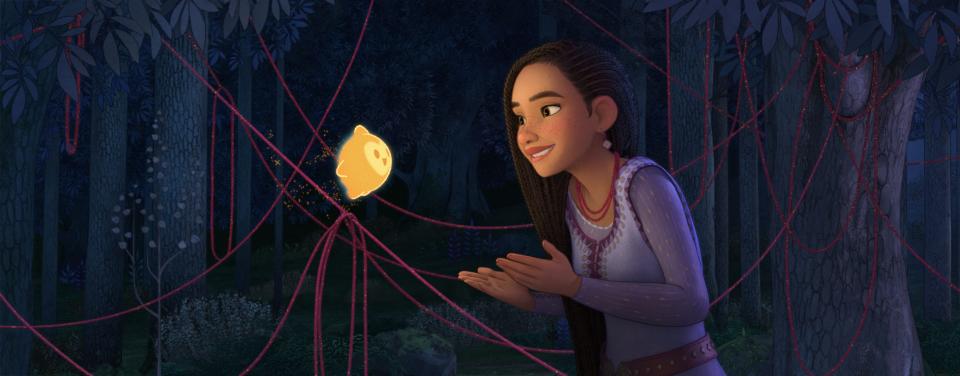 Asha (voiced by Ariana DeBose) wishes on a star to help her people and makes a magical new friend in Disney's animated "Wish."