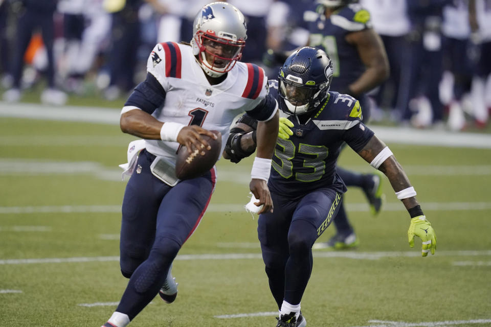 Seattle Seahawks strong safety Jamal Adams (33) closes in on a sack of New England Patriots quarterback Cam Newton (1) during the second half of an NFL football game, Sunday, Sept. 20, 2020, in Seattle. (AP Photo/Elaine Thompson)